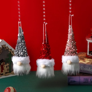Three glowing Christmas gnomes with sequins and faux fur hanging against a red background