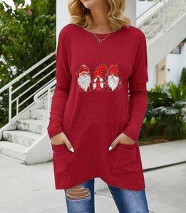 Detail of red Christmas gnome print tunic with functional side pockets and curved hem