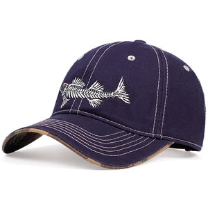 Close-up of fishbone embroidery on navy baseball cap with camouflage under-brim