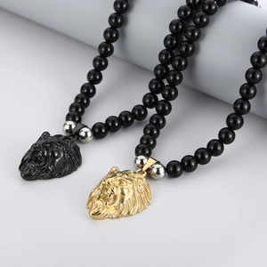 Detail of lion head pendant with gold plating and black onyx prayer beads for men