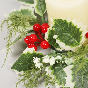 Christmas candle ring with red berries, white-edged leaves, and green pine needles decoration