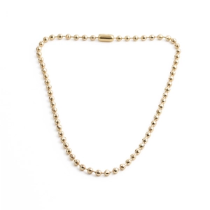 Ensemble collier et bracelet minimaliste en perles dorées facettées sur fond blanc