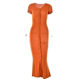 Detail of an orange short-sleeve V-neck knitted dress with front button closure
