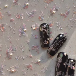 Iridescent laser nail stickers with crane and butterfly motifs on dark manicured nails