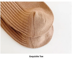 Close-up of the reinforced toe and fine rib knitting on brown cotton socks