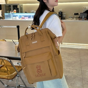 Minimalist khaki large-capacity school backpack with cute bear embroidery and dual straps
