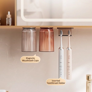 Magnetic toothbrush holder with wall-mounted inverted cups and sleek storage shelf