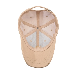 Classic beige cotton baseball cap shown from a bottom view to reveal interior structure