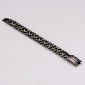 Close-up of vintage industrial gunmetal chain bracelet with plug-in clasp detail