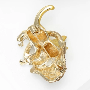 Detailed back view of golden cat brooch showing the pin fastener and safety clasp