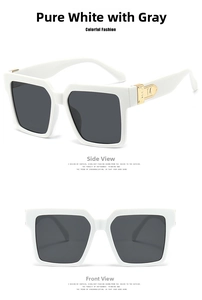 Detail of square oversized white sunglasses with dark grey lenses and golden M logo on temple