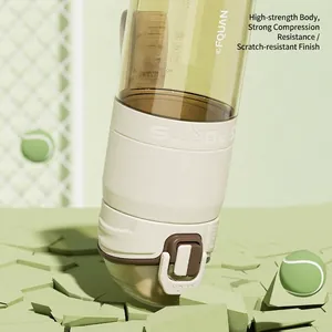 Brown translucent PPSU sports bottle with silicone sleeve on a light green background