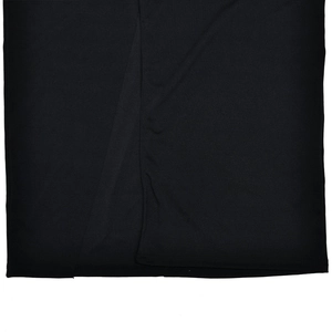 Detailed close-up showing the side seam and fabric texture of the black backless maxi dress