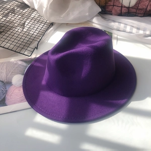 Close-up of deep purple wool felt fedora showing premium fabric texture and wide brim