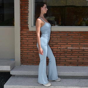 Slim fit light blue two-piece set featuring thin strap tank top and flared high waist trousers