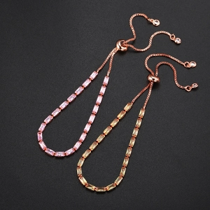 Detail of rose gold adjustable tennis bracelets with pink and champagne rectangle zircons