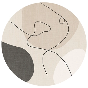 Modern abstract round area rug with beige and grey textured color blocks and black line art