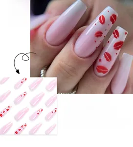 Detail of French long coffin press-on nails with pink base and red kiss lip pattern