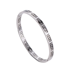 Polished silver stainless steel bangle featuring hollow Greek key pattern and clasp