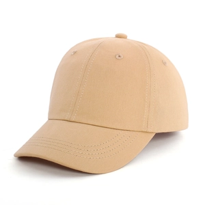 Detail of khaki cotton baseball cap showing reinforced stitching and breathable eyelets