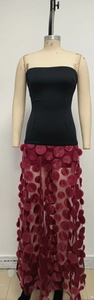 Detail of burgundy mesh skirt featuring black tube top bodice and 3D textured polka dot appliques