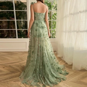 Detailed back view of sage green tulle gown with delicate 3D butterfly floral embroidery