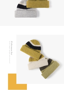 Detailed view of thick ribbed texture and layered cuffs on a two-tone wool knit beanie