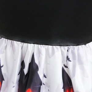 Detail of Halloween dress waist stitching with satin finish and pumpkin silhouettes