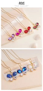 Detail of colorful butterfly pendant necklaces featuring cubic zirconia in seven vivid hues