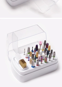 Detailed close-up of 30-hole nail drill bit storage box with various bits inside