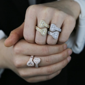 Three-color stack of heart-shaped open rings with pavé zircon setting on female hands