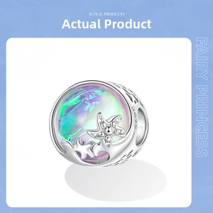Macro detail of S925 silver ocean charm with iridescent opal and starfish accents