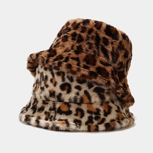 Close-up of leopard print faux fur bucket hats showing thick plush texture and warm material