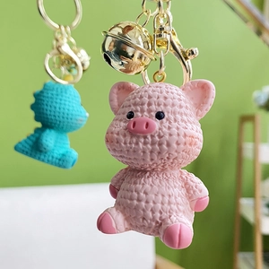 Cute resin cartoon animal keychain with knitted texture including pig and dragon charms