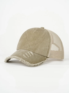 Detail of frayed brim and stitching on vintage khaki mesh trucker hat for outdoor wear