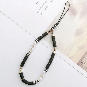 Detailed view of handmade beaded phone strap with black discs and golden LOVE letters