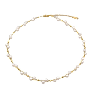 Handmade pearl and gold bead cross-woven necklace with lobster clasp on white background