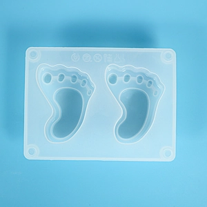 Close-up of silicone baby footprint mold with heat resistance markings and dual cavities
