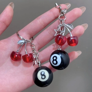 Red cherry and black number 8 pool ball keychain with silver star and leaf charms