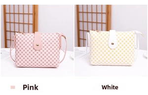 Detail of pink and white crossbody bags with geometric dot patterns and metal buckles