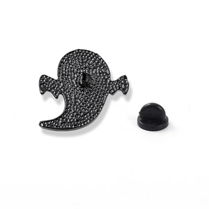 Black ghost-shaped metal enamel pin with rubber clutch back and textured finish