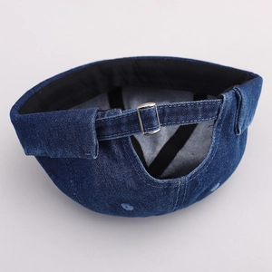 Detail of adjustable silver metal buckle on navy blue denim Miki Hat for unisex