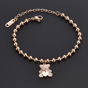 Rose gold stainless steel beaded bracelet featuring a bear charm and engraved heart pendant