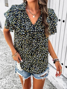 Detail of floral V-neck top with ruffled short sleeves and feminine frill accents