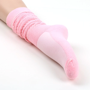Detailed view of pink slouch socks featuring thick terry knit texture and ribbed cuffs