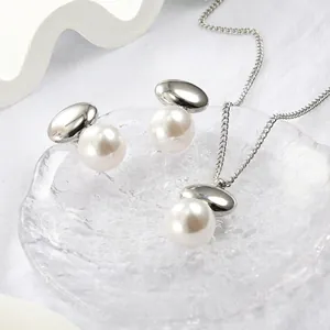 Elegant stainless steel oval jewelry set with pearl necklace and stud earrings