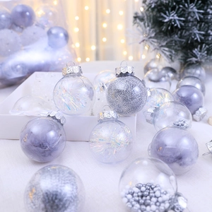 Shatterproof Christmas ball ornaments with feathers and sequins on a festive tree branch