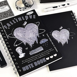 Detail view of black Y2K aesthetic spiral notebooks with heart and David statue designs