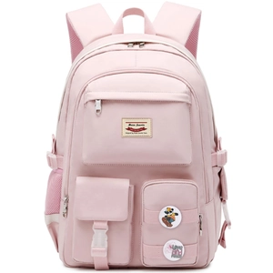 Close-up of pink backpack showing functional front pockets and decorative fashion badges