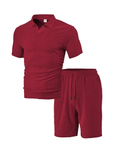 Close-up of dark red men's sportswear set showing vertical stripe knit texture and label